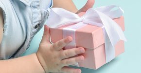 A gesture with children's hands giving a gift.