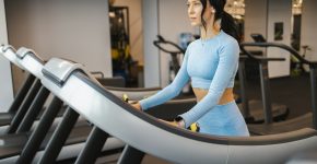 Fitness woman walking on a treadmill