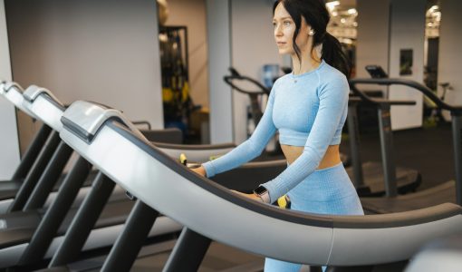 Fitness woman walking on a treadmill